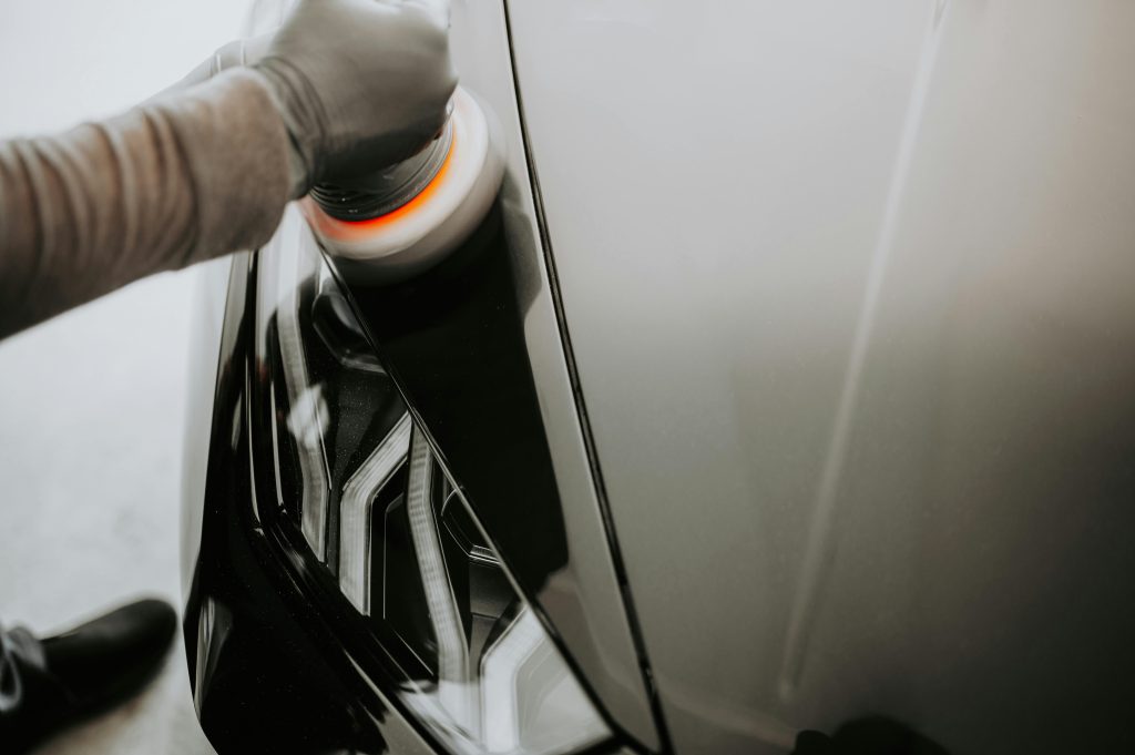 Person Cleaning a Black Car