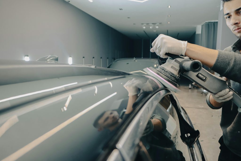 Man Polishing a Car Roof