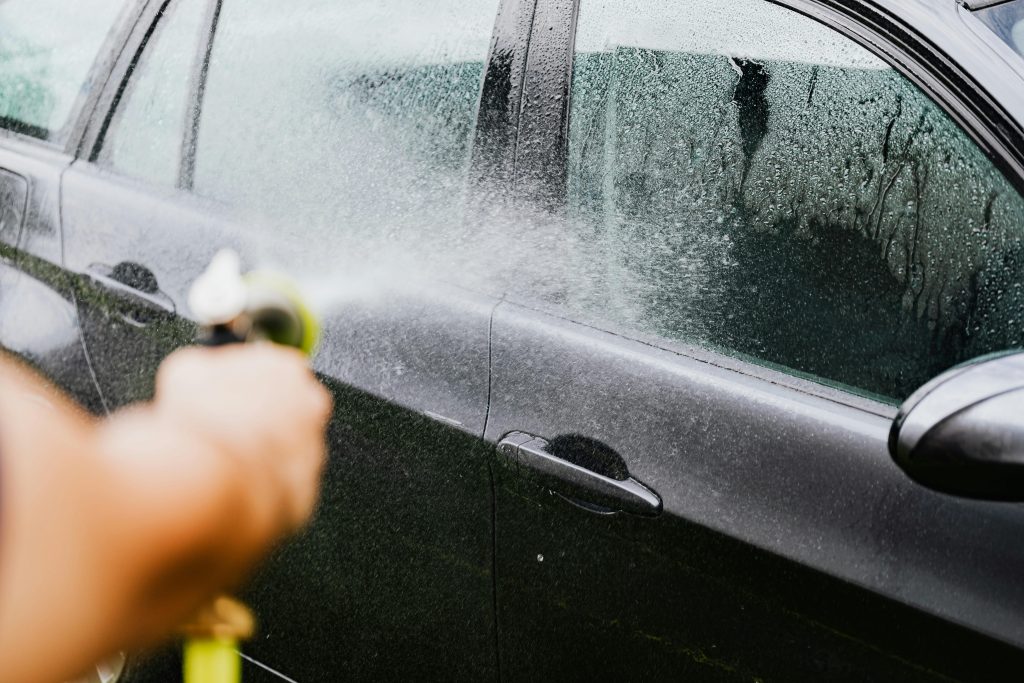 A Person Washing a Car